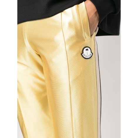 MONCLER PALM ANGELS Pantaloni sportivi effetto metallizzato oro con bande bianche laterali