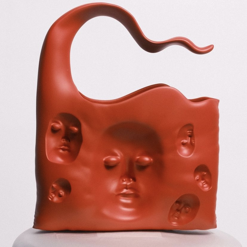 Borsa Sana Marks rossa e nera dalle forme simili a fiamme