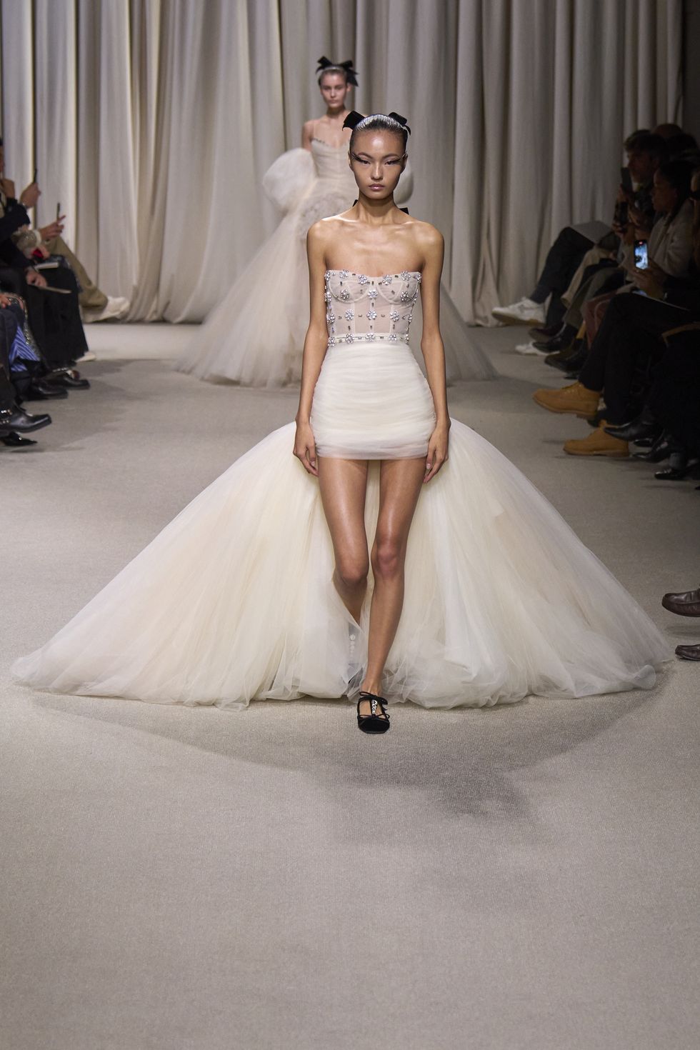 Giambattista Valli model with roses in her hair on the runway