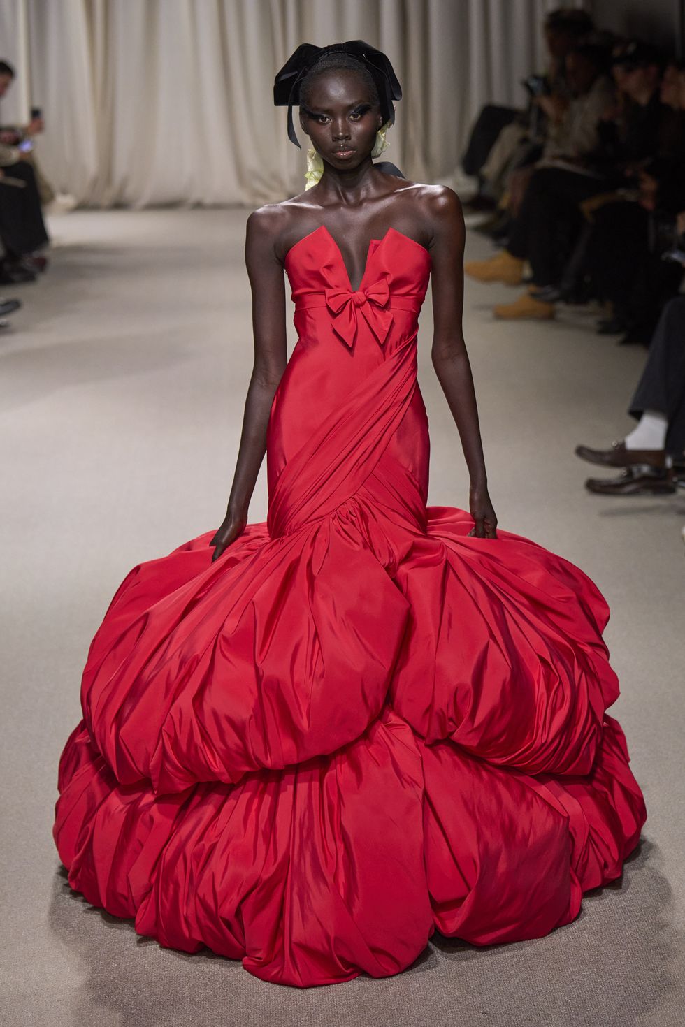 Structured fuchsia and pink gowns like giant roses at the Valli show