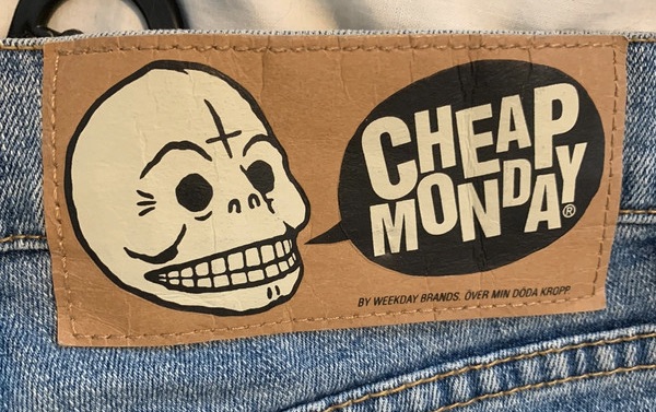 Cheap Monday skinny jeans with the signature skull back label