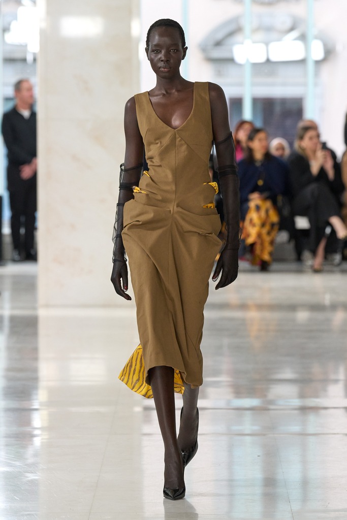 Model on the Feben runway wearing upcycled plastic bead details