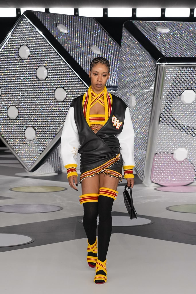 Off-White garment with ASK LEGAL lettering on the runway