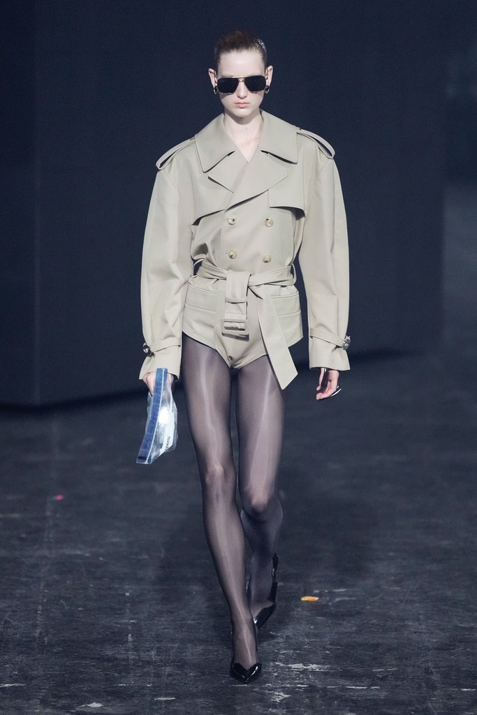 Structured dress with suspended hem at the Coperni show