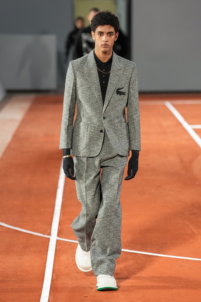 Model on the runway in a Lacoste piece mixing Parisian elegance and sportswear