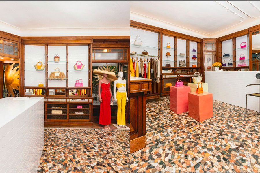 Sole in metallo dorato nella vetrina del pop-up Jacquemus