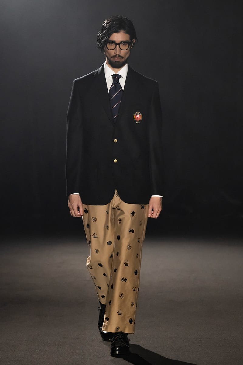 The Junya Watanabe MAN x Stüssy FW26 look from another angle: the Stüssy micro-logos on the trousers