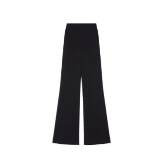 Pantalone PETER, di Sportamx, da donna, colore nero. Modello a vita alta e gamba aderente leggermente svasata al fondo. Realizzato in jersey scuba tecnico. Apertura con zip posteriore, tasche a filetto sul retro e pieghe stirate. Vestibilità reg