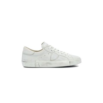 Sneakers PRSX di Philippe Model, da uomo, colore bianco. Modello  con tomaia in pelle di vitello colore bianco. Parte posteriore e logo tono su tono. Caratterizzato dal logo scudetto sul lato della scarpa. 