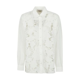 Camicia di Ermanno, da donna, colore bianco. Modello a maniche lunghe, caratterizzato da dettagli macramè sul davanti e chusura con bottone ai polsi. Chiusura con bottoni e colletto classico. Vestibilità over. 