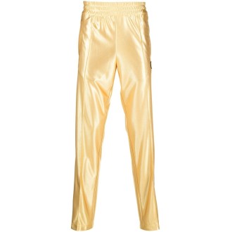 MONCLER PALM ANGELS Pantaloni sportivi effetto metallizzato oro con bande bianche laterali